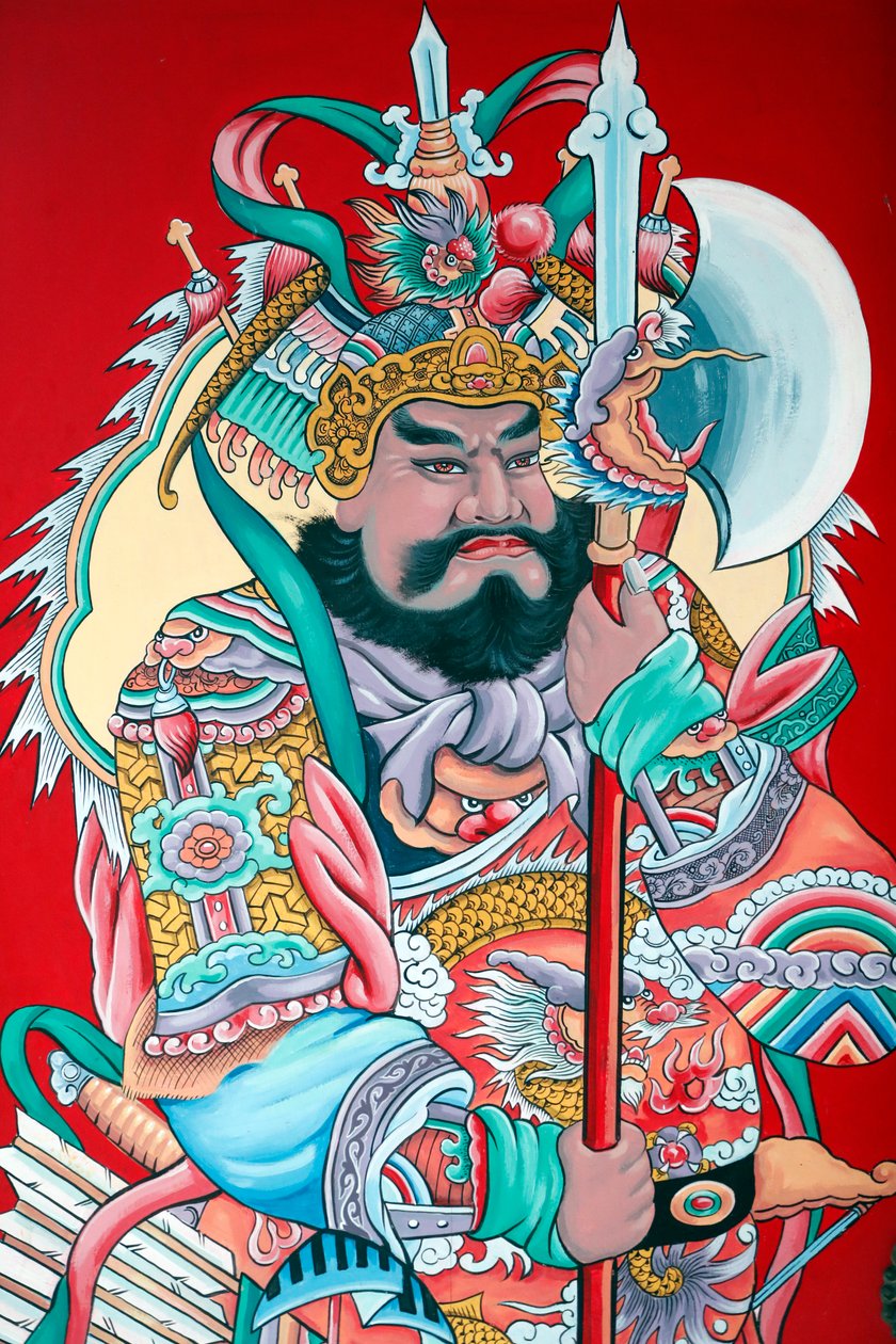 Hoi Tuong Te花buddist中国人寺庙。门上的卫报人物画。富国。越南。 作者 不明