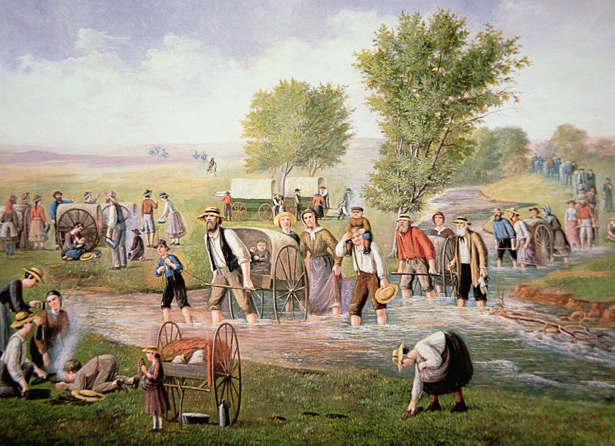 1856年，摩门教拓荒者在前往盐湖城的漫长旅途中拉着手推车（彩色平印）。 作者 美国学校