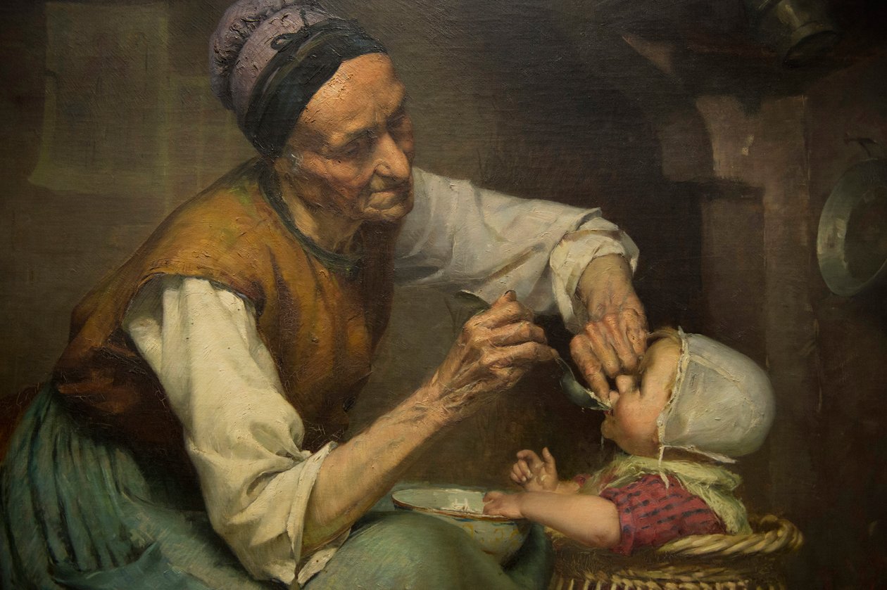 一位老妇人用柳条婴儿学步车喂养孙女，Edouard Jerome Paupion 摄 作者 爱德华·杰罗姆·帕皮恩