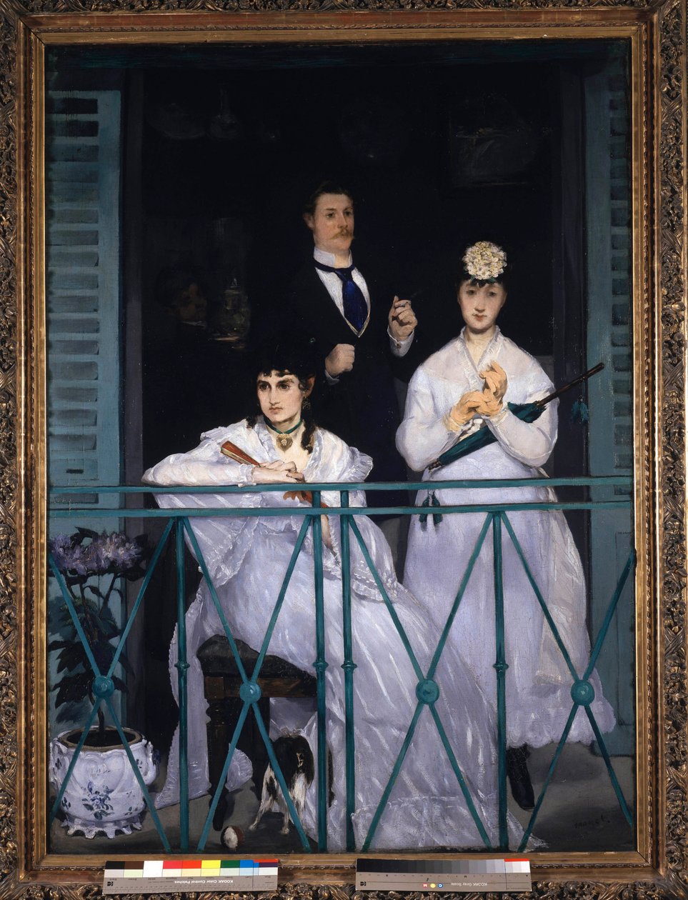 Balcony Two young women holding a fan and an umbrella and a man with a tie. Portrait of Berthe Morisot (1841-1895), French painter, Fanny Claus (1846-1877), violinist, Antoine Guillemet (1841-1918) landscaper and background Leon Leenhoff. Painting by Edoua 作者 爱德华·马奈