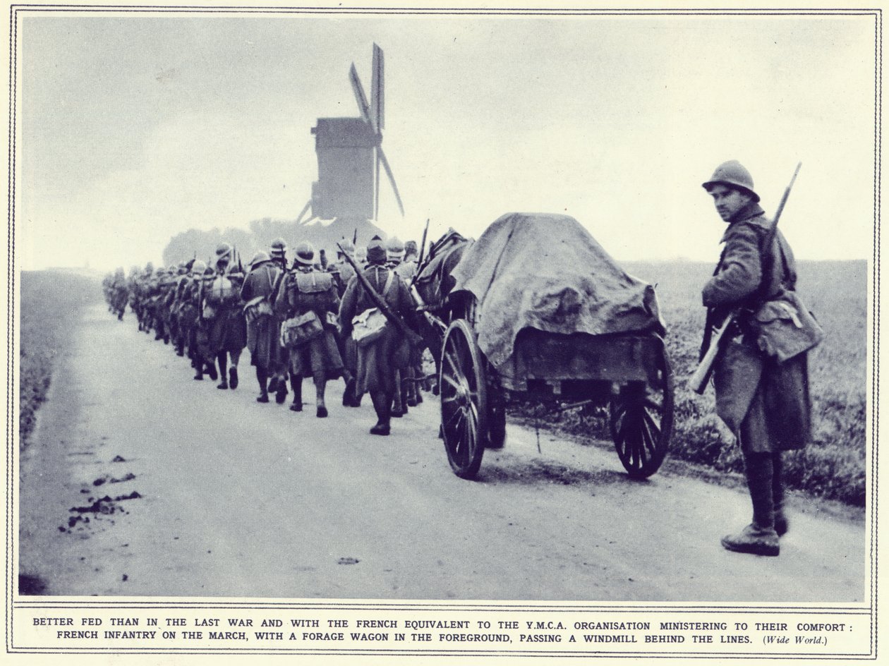 1939年11月22日出版的“画报战争新闻”上的法国步兵游行队伍，前面有一辆饲料车 作者 英国摄影师