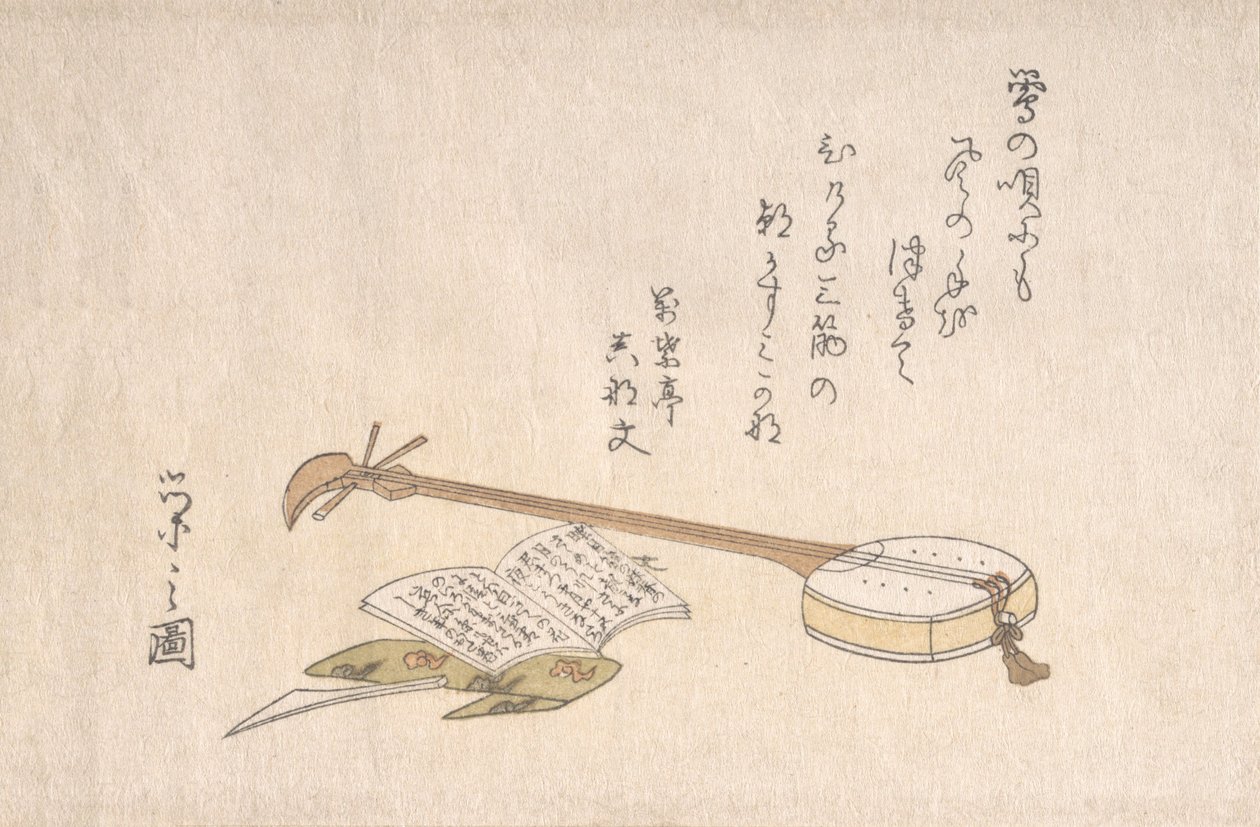 三味线、拨浪鼓和一本书。 作者 细田英史