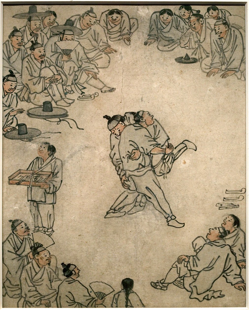 传统摔跤的场景，有观众和卖糖果的人。丹原（金弘道）（1745-1806 年）的画作，纸上水墨，Coreen 艺术，朝鲜（朝鲜）时期，18 世纪。韩国国立博物馆，首尔（韩国）。 作者 金弘道