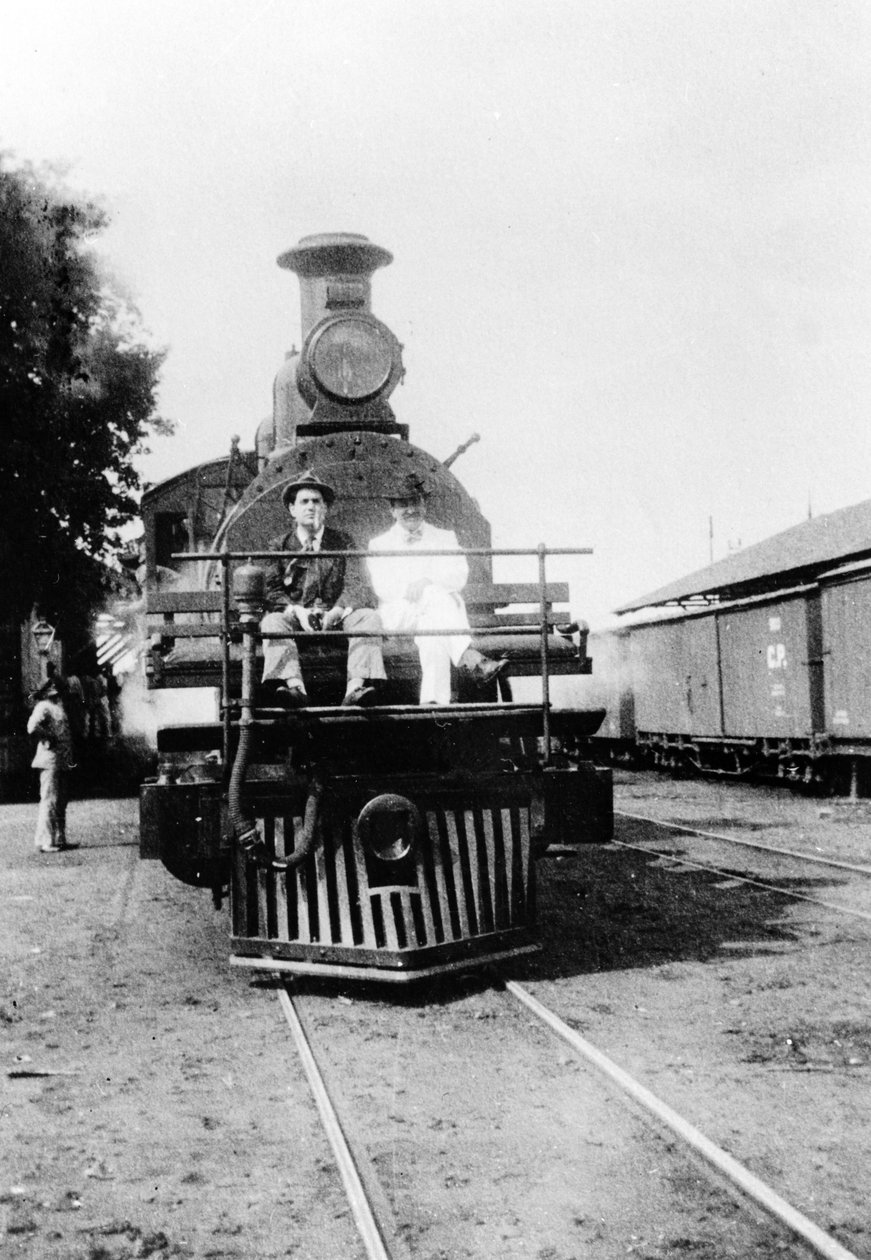 Darius Milhaud and Paul Claudel seated on a steam trip on a trip while 