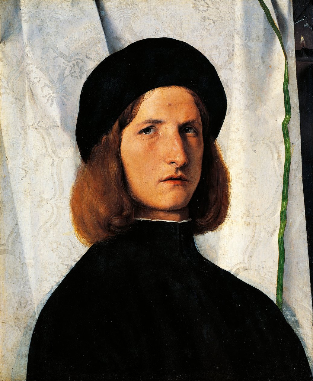 拿着灯的年轻男子的肖像 作者 洛伦佐·乐透（Lorenzo Lotto）
