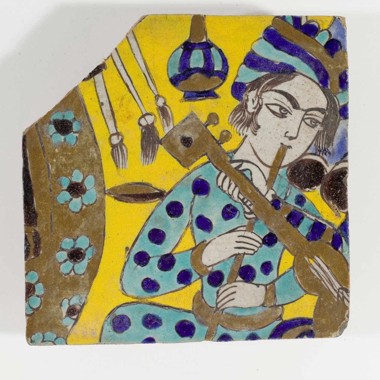 17世纪晚期的Safavid Persia cuerda seca陶砖，描绘了一个男人在头巾中演奏长笛 作者 波斯学校