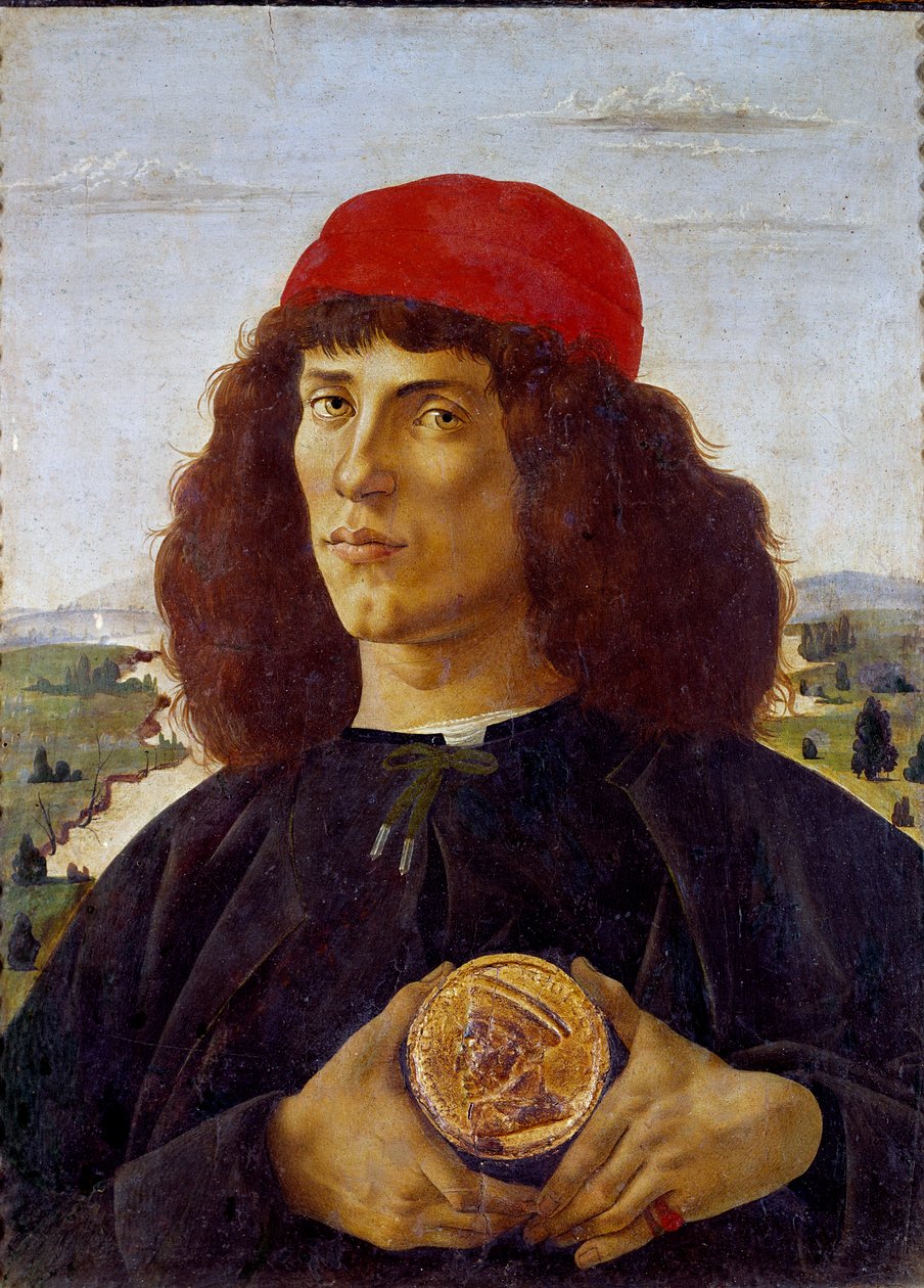 一位不知名的男子手持科西莫·德·美第奇 (Cosimo de Medicis) 勋章的肖像。 Alessandro di Mariano dei Filipepi dit Sandro Botticelli (1445-1510) 的绘画。 画布上的蛋彩画，57.5 x 44 厘米 作者 桑德罗·波提切利（Sandro Botticelli）