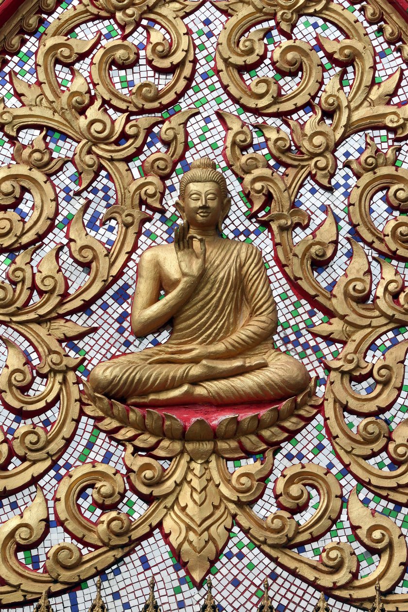 20151102, Vang Vieng, Laos : Entrance door ornamented with gold reliefs. The Teaching Buddha depicts a particular moment in the life of the Buddha, namely, the first sermon the Buddha gave after reaching Enlightenment 作者 不明