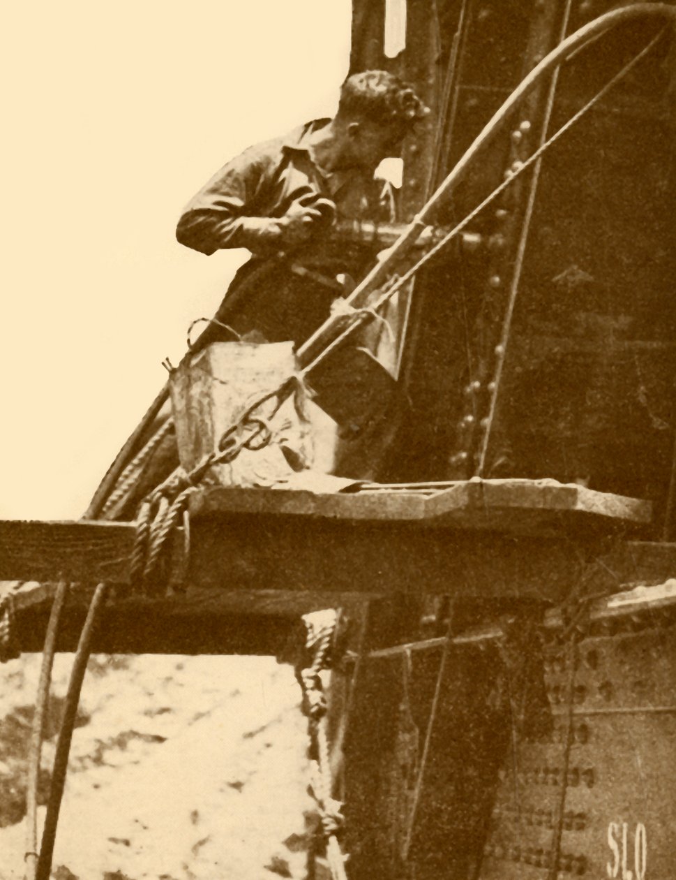 大约在1930年在悉尼海港大桥上运行的铆钉锤。 作者 不明