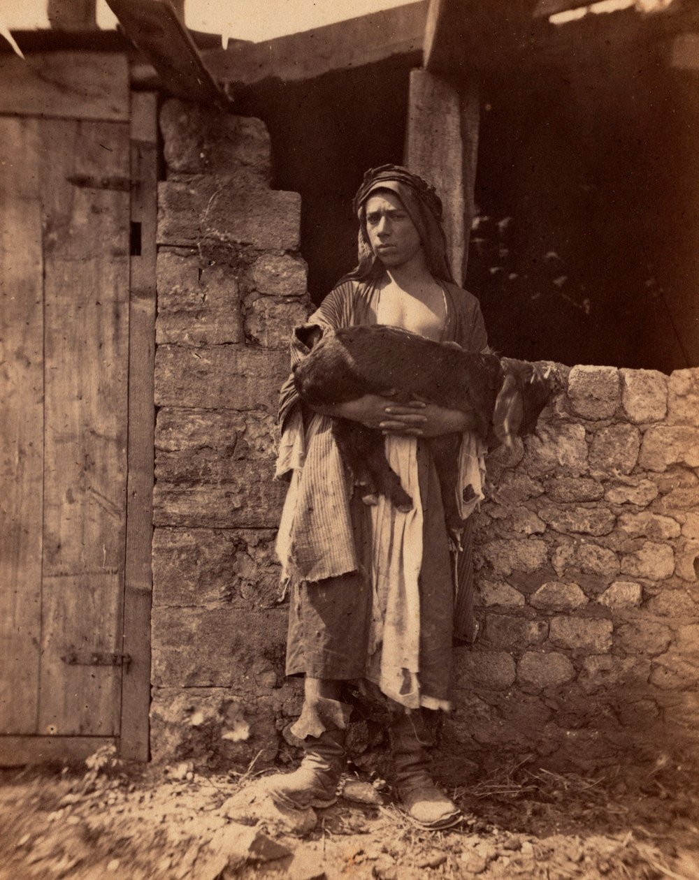 黎巴嫩的帕特雷和一个孩子。Charles Lallemand（1826-1904 年）在 "叙利亚、服饰、航行和风景 "中的摄影作品。1865.私人收藏。 作者 未知艺术家