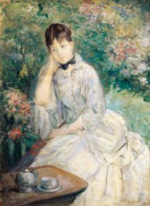 坐在沙发上的年轻女子。 作者 贝特·莫里索（Berthe Morisot）