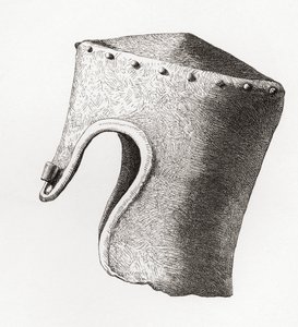 13 世纪带鼻孔的圆柱形平顶头盔，1841 年在蒙哥马利城堡挖出，摘自《英国军队》：其起源、发展和装备》，1868 年出版。 作者 英语学校