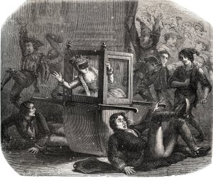 一群小丑让玛丽-泰蕾兹（Marie Therese）-勒瓦瑟尔（Levasseur）（1721-1801），一个狂欢节的服装，在她的轮椅上无法前进。她是那些曾经的恋人之一的报复的受害者。雕刻于1871年的 "Histoire Des Cocus C"。 作者 法语学校