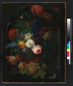 A basket of flowers with fruit