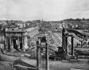 The forum in Rome with ruins of ancient monuments: arch of Septime Severe (l), columns of Saturne temple (r) and columns of Vespasian temple (c, foreground) (b/w photo)
