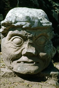 Stone sculpture of a old man head called the old man of Copan, temple 11