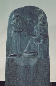 救赎太阳神Shamash的形象在他的着名法典，公元前1760年的旧巴比伦时期（汉玄武岩）向汉谟拉比国王指明他的法律 作者 美索不达米亚