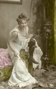 Undressing girl (colour photo)