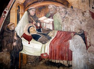 Saint Scolasticus (v. 480- v. 543) 之死，她是 Nursie 的圣本笃的妹妹，她周围都是本笃会修士。 15 世纪翁布里亚学校的壁画。 圣贝内代托修道院（Sacro Speco），苏比亚科（罗马），意大利 作者 翁布里亚学校