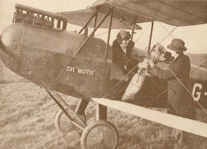 乘飞机飞到27-60马力的飞蛾轻型飞机上的高尔夫球杆上，1927年 作者 不明