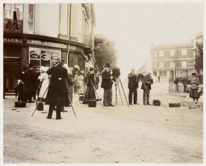 "Group of photographers taking photographs in the street" 作者 不明