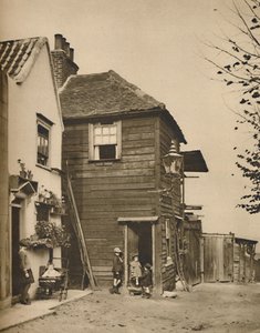 海格特的老房子从门口的村民们观看教练通行证，摄于1935年。 作者 不明