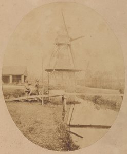 [戴帽子的画家在画架前画风车] 作者 Louis Désiré Blanquart Evrard