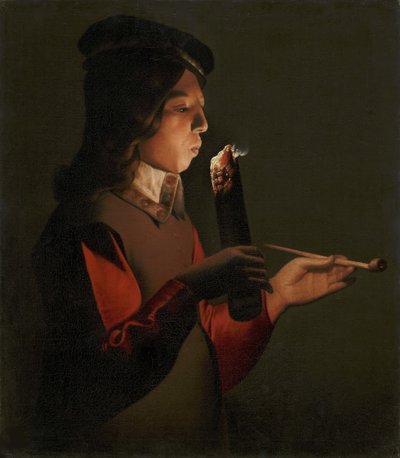 Un jeune garcon avec une pipe, souffle sur un brandon - 一个拿着烟斗的小男孩，吹着火种，由La Tour, Georges, de (1583-1652)。布面油画 作者 乔治·德拉图尔