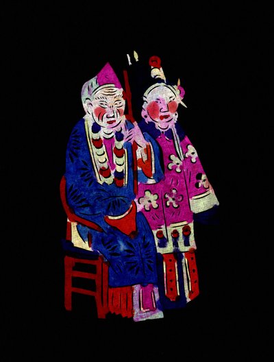 身着传统服装的夫妇。彩绘剪纸或 "简牍"，中国民间艺术，北京。 作者 学校中文