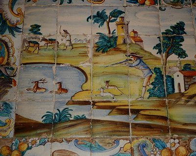 描绘猎人射鹿的Azulejos瓦片（陶瓷）。 作者 学校西班牙语