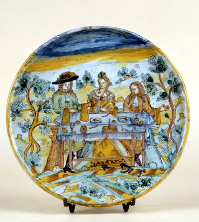 塔拉维拉（Talavera de la rejna）（西班牙）陶瓷盘上的户外宴会的表现。16世纪初。米兰，卡斯特罗博物馆。 作者 西班牙语学校