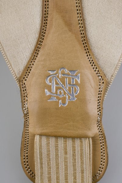 Suspenders, c.1880 (detail view), Emroidered white satin, leather, silver, Maker unknown 作者 未知艺术家