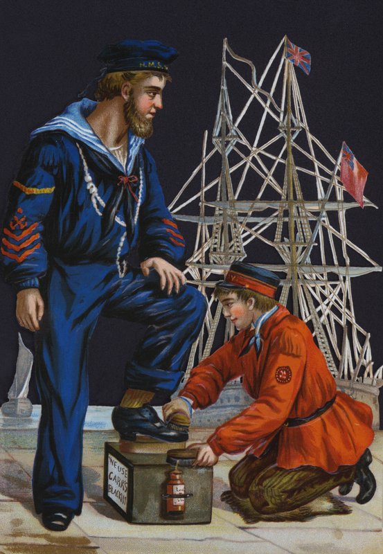 Shoeshine boy polishing a salor